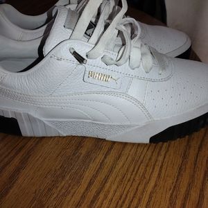 White and black puma tennis shoes